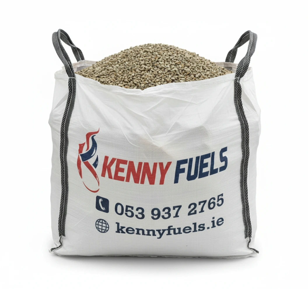 Large white bulk bag filled with golden gravel stone 14mm, featuring black lifting loops and branded with the Kenny Fuels logo in red and blue flame design. Contact details are printed on the front, indicating a bulk fuel product for heating use.