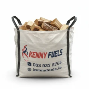 Large white sack filled with softwood, featuring black handles and branded with the Kenny Fuels logo in red and blue flame design. Contact details are printed on the front, indicating a bulk fuel product for heating or delivery use.