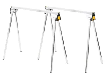 Pair of metal sawhorses with adjustable legs and a horizontal support beam are set up on a flat surface. Their foldable design and lightweight frame suggest portability and stability for woodworking or construction tasks.